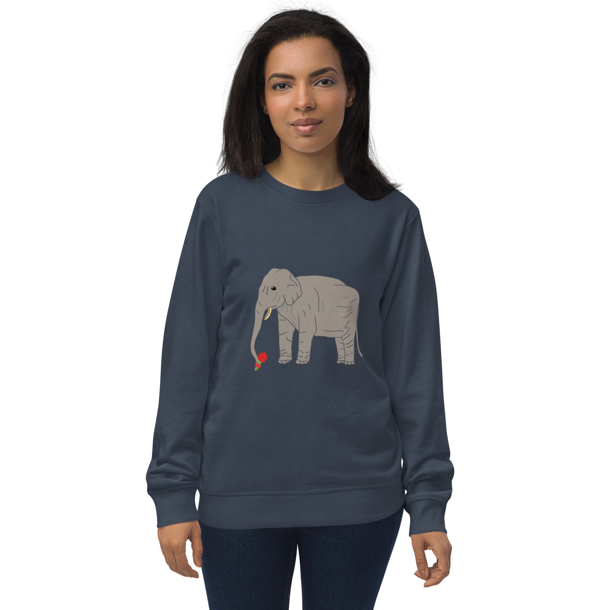 Woman wearing a navy organic sweatshirt featuring an illustration of an elephant holding a red rose with its trunk. The design blends gentle elegance with eco-conscious fashion.