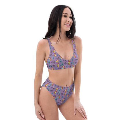 A right-angled front view of a woman in a sustainable, high-waisted bikini featuring a colorful mushroom pattern, highlighting the adjustable fit and comfort.