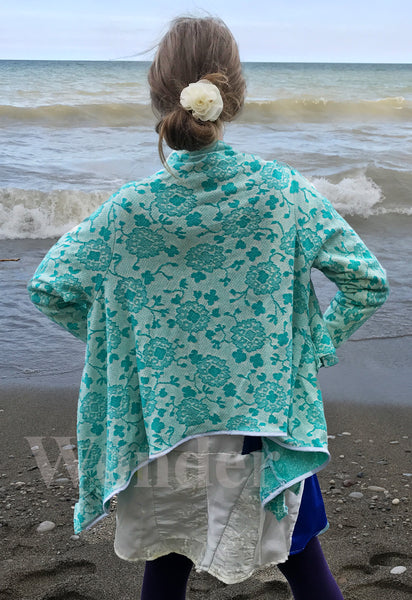 Floral Women's Cardigan in mint green is shown from the backside.