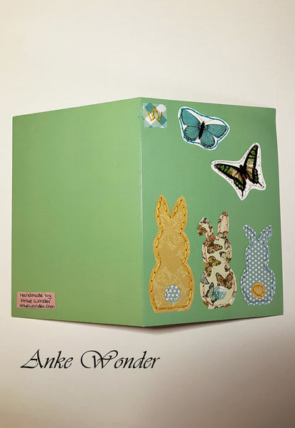 Hand-Embroidered greeting card with three colorful bunnies and butterflies  for gifting.