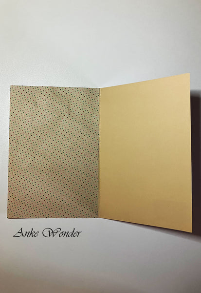 Beige paper with dots inside of a greeting card.