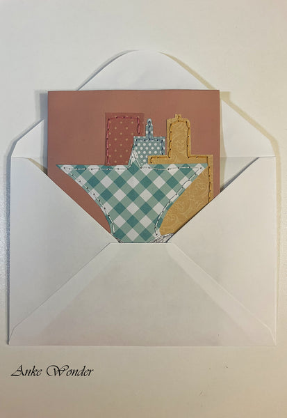 Handmade card with a colorful Milwaukee skyline in a white envelope.